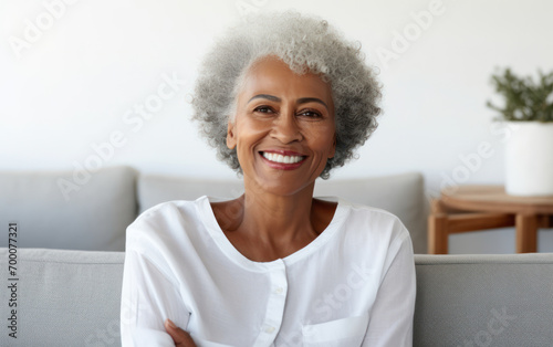 portrait of senior woman sitting on sofa at living room. Generative AI.