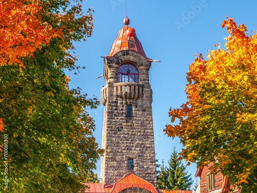 Cerna Studnice - stone lookout tower in Jizera Mountains, Czech Republic. Sunny autumn day. photo