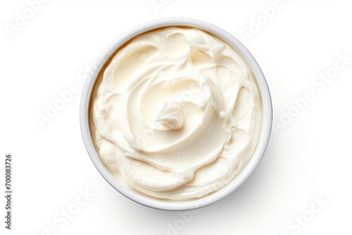 Cream cheese in a bowl white background top view photo