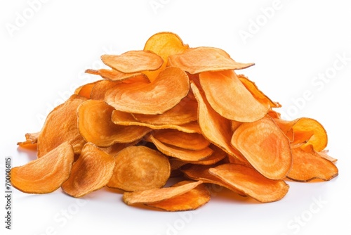 Healthy sweet potato chips stacked on white background photo