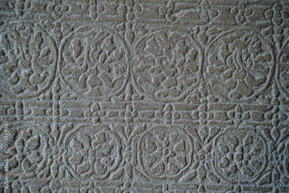 Ancient asian stone wall with flower ornaments in Cambodia Angkor Wat Siem Reap for pattern background Ancient asian stone wall with flower ornaments in Cambodia Angkor Wat Siem Reap for pattern background