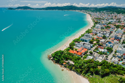 Holiday beach with resort town and turquoise ocean in Brazil. Aerial view photo