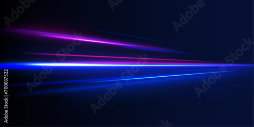 Light and stripes moving fast over dark background. Modern abstract high-speed movement. Colorful dynamic motion on blue background. 