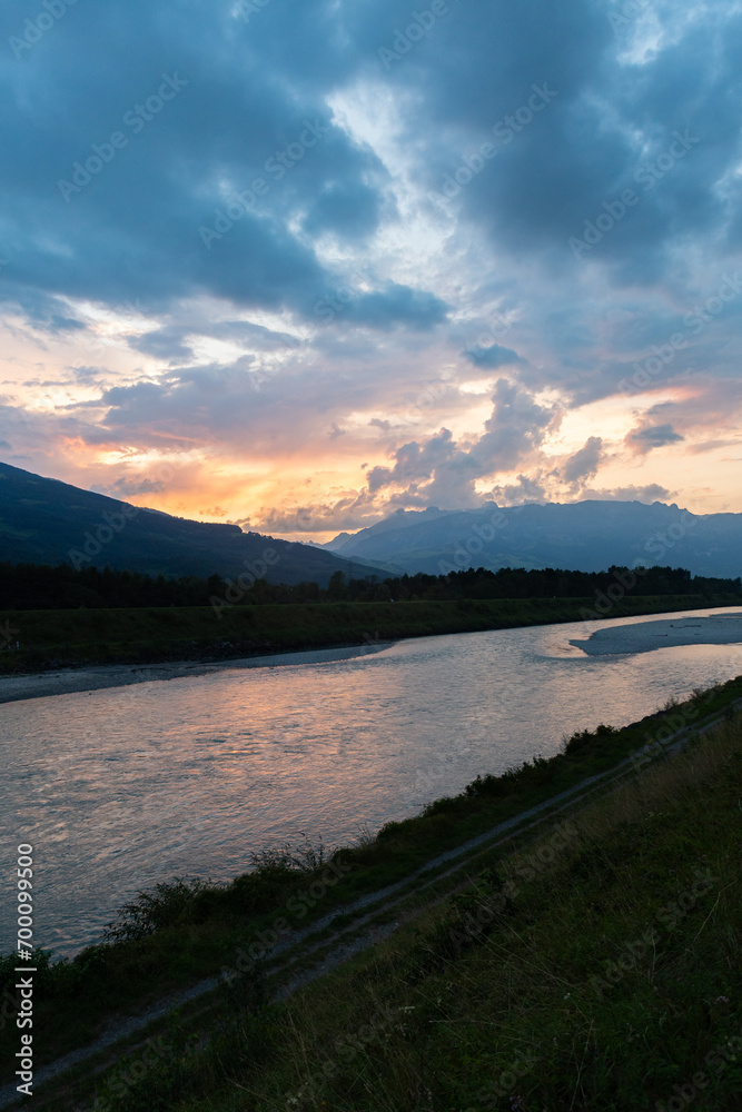 Sunset at the rhine river in Vaduz in Liechtenstein