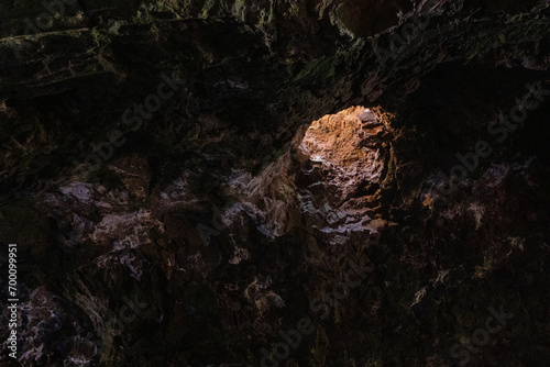 Interior of the cave of Los Jameos del Agua. Light at the end of the cave. Lanzarote, Canary Islands, Spain.