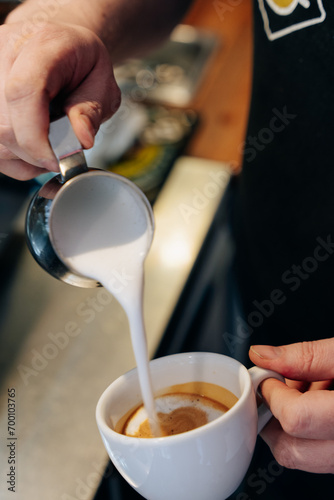 Fototapeta Naklejka Na Ścianę i Meble -  coffie making process. Barista work. milk. latte