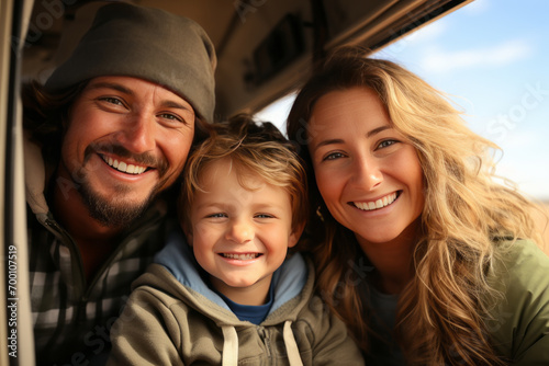 Portrait of a happy married couple with their son traveling by car.