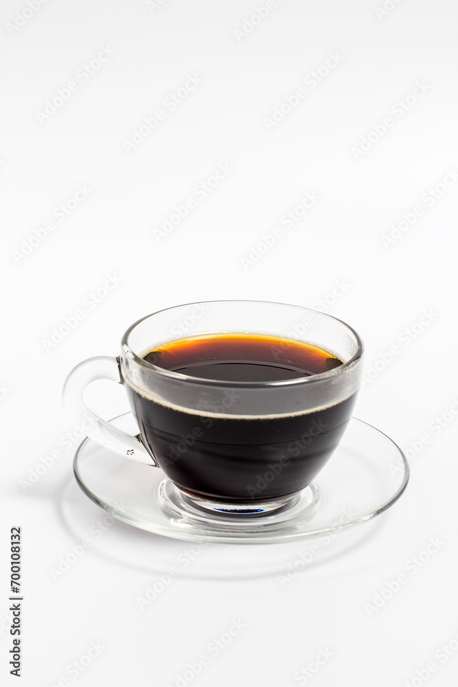 Black coffee in a glass mug on a white background, aromatic coffee for energy Black coffee in a glass mug on a white background, aromatic coffee for energy