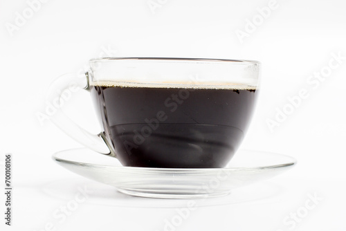 Fototapeta Naklejka Na Ścianę i Meble -  Black coffee in a glass mug on a white background, aromatic coffee for energy