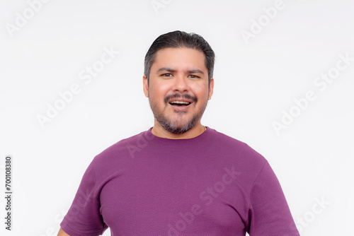 A middle aged man with an amused look on his face. Laughing off a flimsy statement or claim. Isolated on a white background. photo