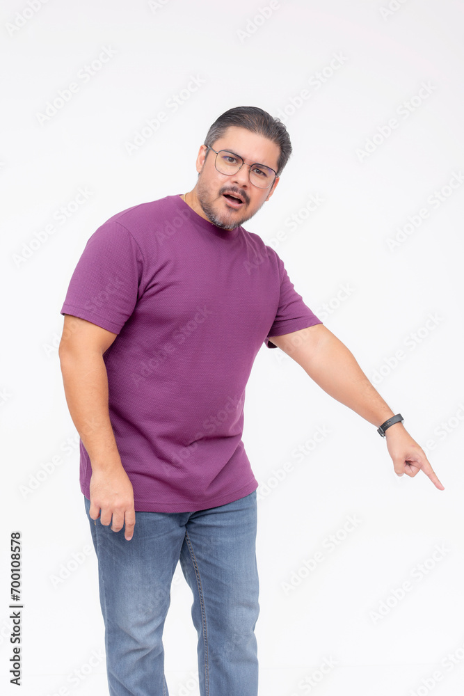 A middle aged man looking puzzled and befuddled while pointing to something below to the right, 45 degree angle. Full body photo, isolated on a white background. A middle aged man looking puzzled and befuddled while pointing to something below to the right, 45 degree angle. Full body photo, isolated on a white background.
