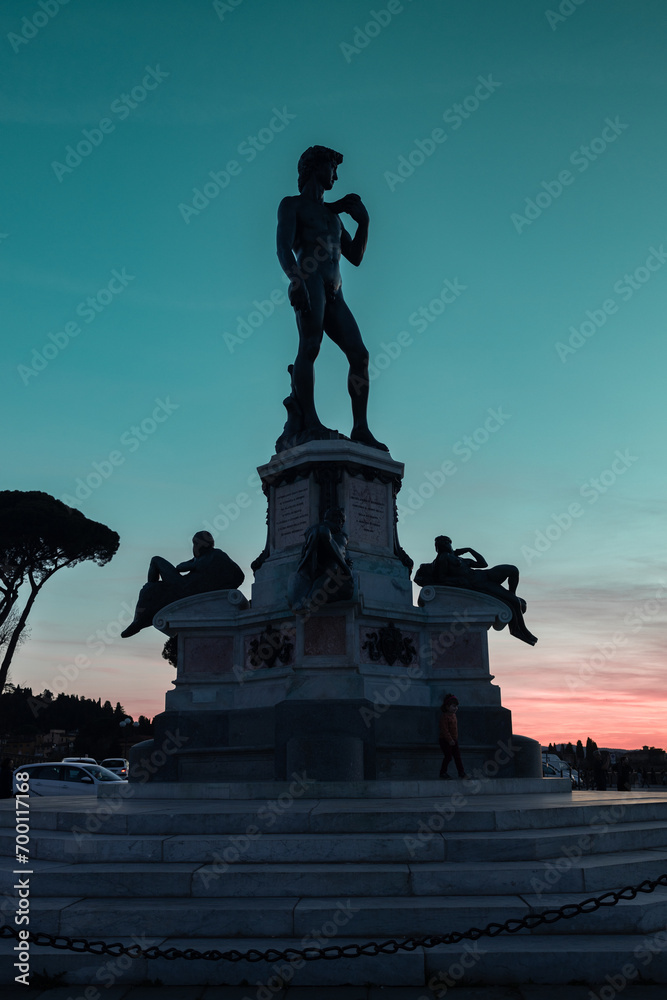 The replica of Michelangelo's David statue in Michelangelo Square during sunset in Florence, Italy. High quality photo