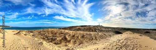 panorama view at Faro de Trafalgar, lighthouse at a sandy dune headland between Los Caños de Meca and Zahora, Conil de la Frontera, Vejer de la Frontera, Costa de la Luz, Andalusia, Spain photo