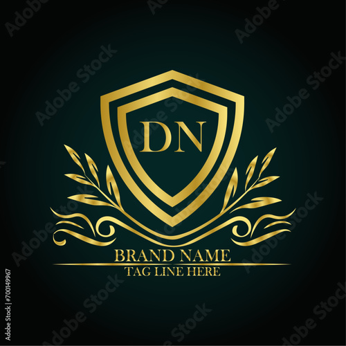 DN luxury letter logo template in gold color. Elegant gold shield icon. Modern vector Royal premium logo template vector