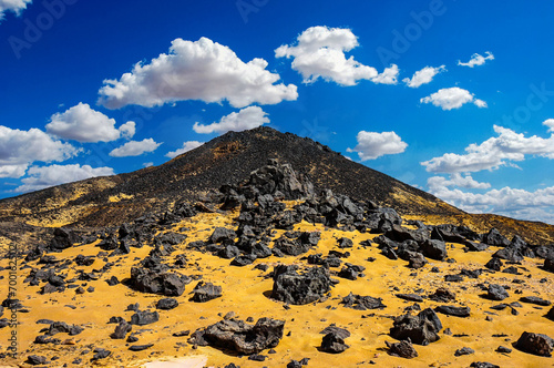 Black rocks in the Meroe in the Sahara desert photo