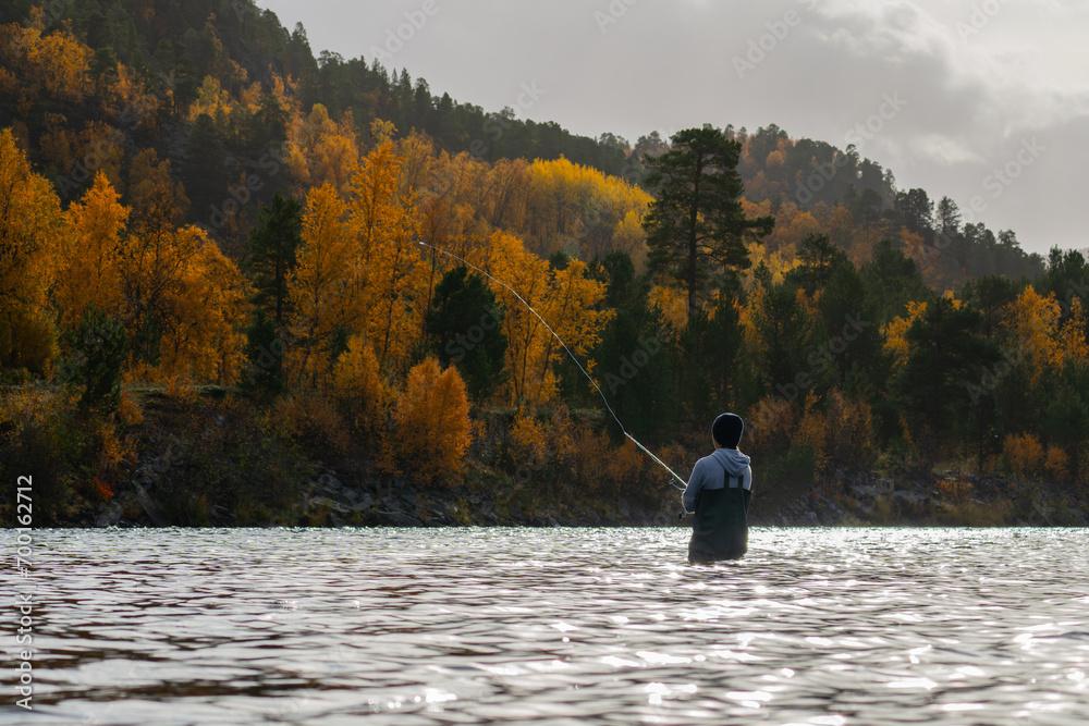 A salmon fisherman in a salmon river in Norway