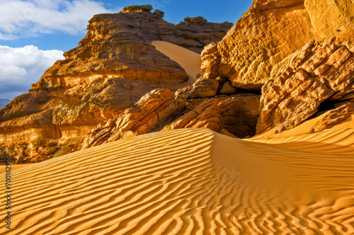 Sand dune and rocks in the Sahara desert photo