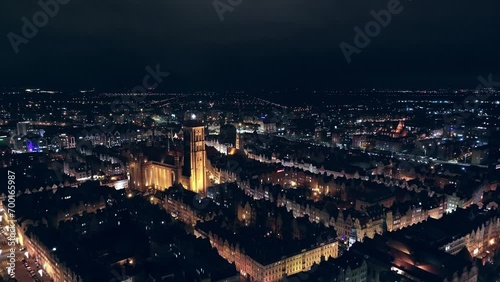 Wallpaper Mural A mesmerizing drone film captures Gdańsk's city center at night in December. Glowing city lights and moving cars create a festive urban scene. Torontodigital.ca