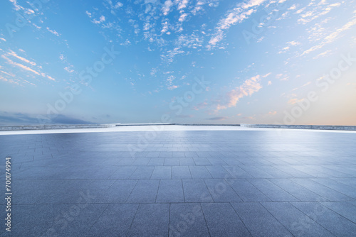 Empty brick floor and sunset clouds background © zhao dongfang