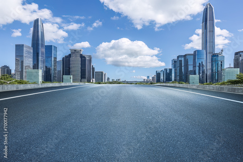 Empty asphalt road and city buildings skyline in Shenzhen photo