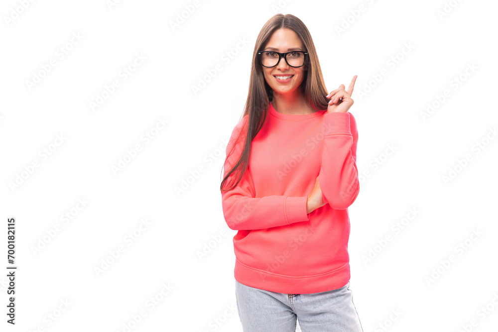 young caucasian model woman with light make-up and dark straight hair dressed in a pink sweater wears eyeglasses young caucasian model woman with light make-up and dark straight hair dressed in a pink sweater wears eyeglasses