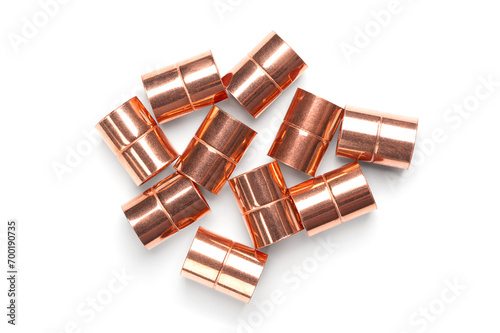 Copper sleeves, weld-in sockets, soldering fittings, and connectors for installation on copper pipes, and for use in plumbing or mechanical applications. With a diameter of 15 mm and of 20 mm length. photo