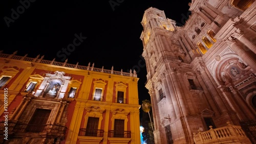 Night view of Malaga Cathedral, paired with the Centro Cultural Fundacion Unicaja, Andalucia, Spain, blends historic grandeur with modern arts photo