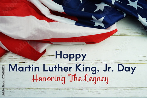 Happy Martin Luther King Jr Day text messege  with USA flag on wooden background photo