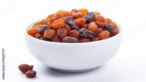 Raisins in bowl isolated in white background