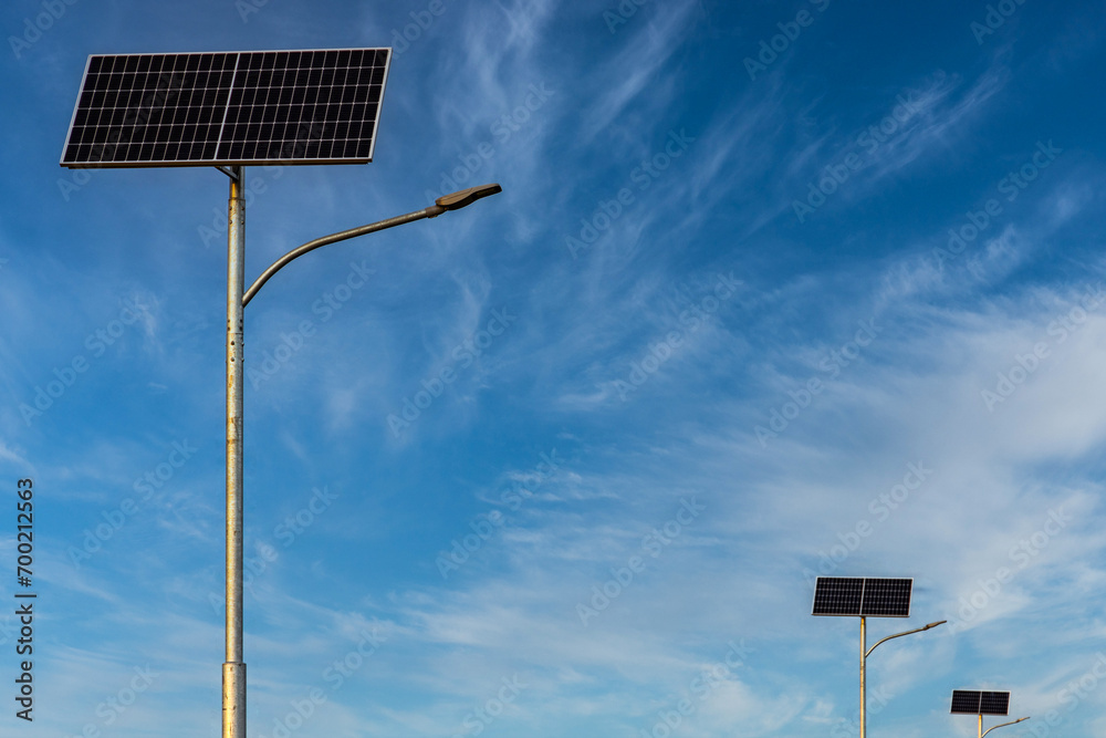 Photovoltaic panels used to illuminate the road against the sky. Roadside lamps. Ecological, renewable energy sources. Photovoltaic panels used to illuminate the road against the sky. Roadside lamps. Ecological, renewable energy sources.