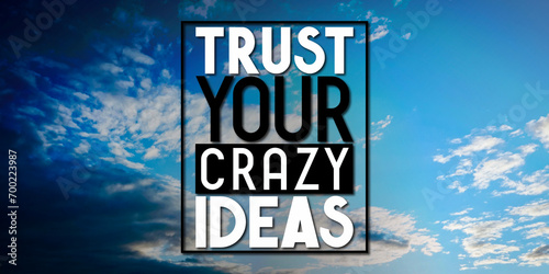 Trust your crazy ideas - inspirational quote and sky with clouds photo
