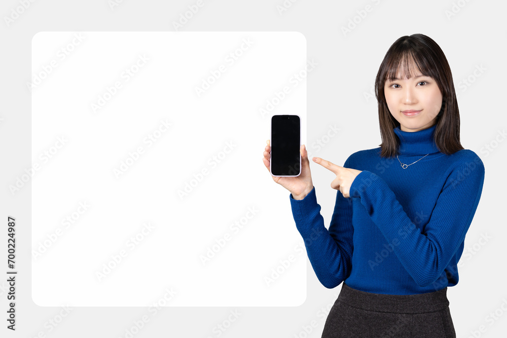 Naklejka premium スマホを指差す女性_背景白枠スペース付き