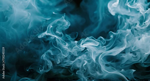 Smoke swirling in the air on a dark background. photo