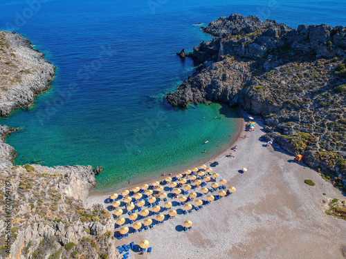 Aerial panoramic view of the famous rocky beach Melidoni in Kythira island at sunset. Amazing scenery with crystal clear water and a small rocky gulf, Mediterranean sea, Greece, Europe.