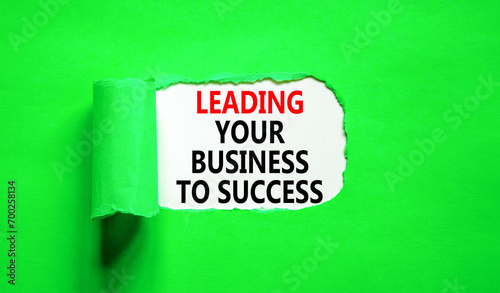 Leading your business to success symbol. Concept words Leading your business to success on beautiful white paper. Beautiful green paper background. Leading your business to success concept. Copy space