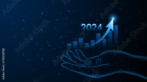 Abstract hand holds a stock market graph with rising candles for future company growth in 2024. Business expansion concept or profitable investment.
