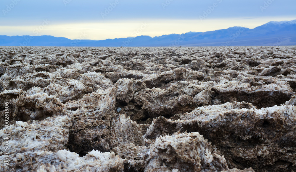 Death Valley National Park, Salt with clay, California. Smooth salt valley with cracked and swollen salt, dead salt landscape Death Valley National Park, Salt with clay, California. Smooth salt valley with cracked and swollen salt, dead salt landscape