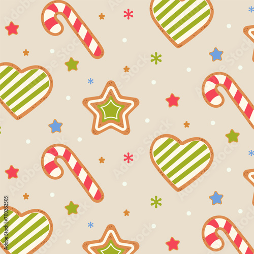 Seamless pattern with cute Christmas gingerbread cookies. Candy cane, heart, star, gingerbread on a beige background. Vector illustration