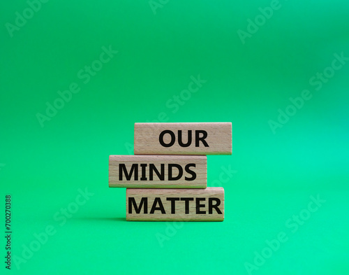 Our Minds Matter symbol. Concept words Our Minds Matter on wooden blocks. Beautiful green background. Psychological social and Our Minds Matter concept. Copy space.