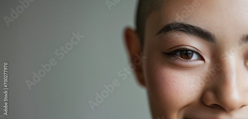Close Up On Eyes Of Young Asian Teen Looking at Camera.