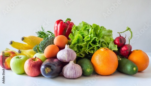 Healthy fruits and vegetables on white background