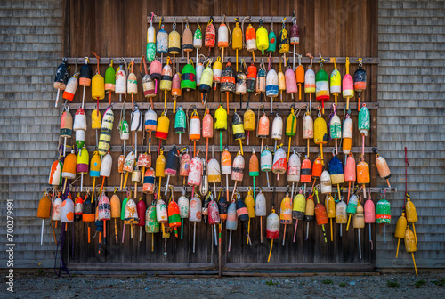 A wall of colorful buoys in Maine photo