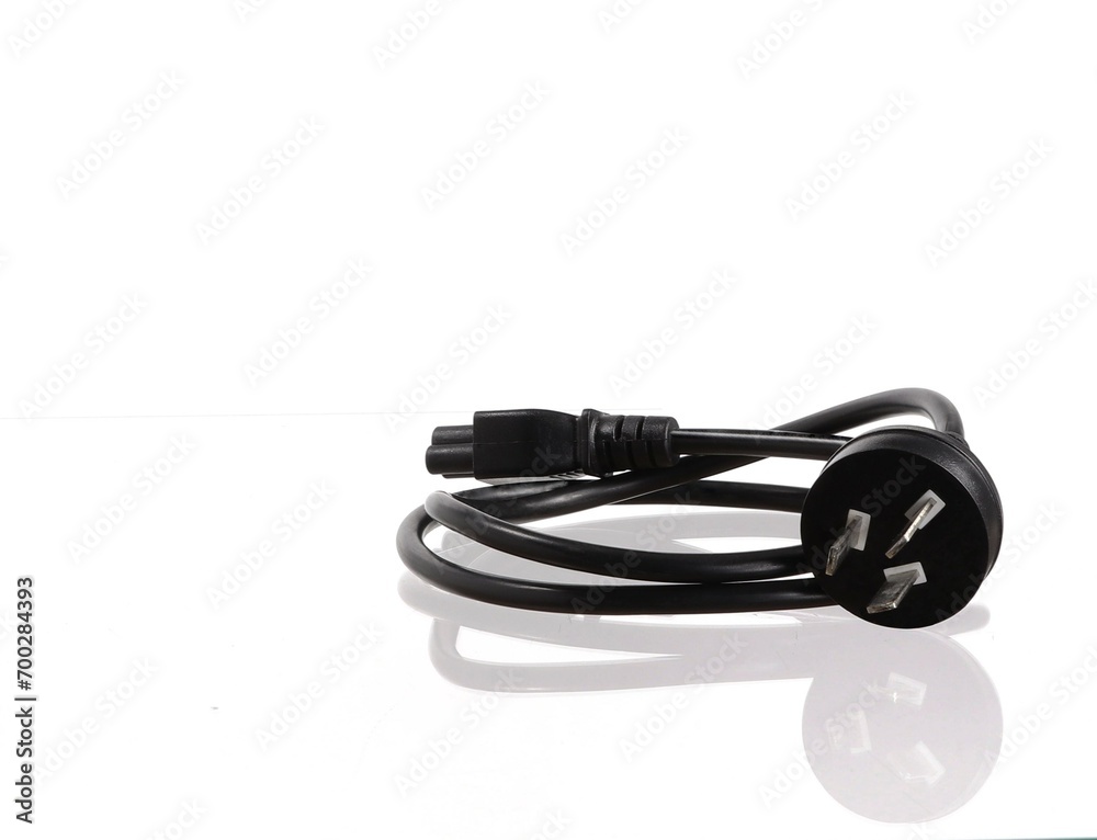 Black electrical plug with pins and cable on a white background. Black electrical plug with pins and cable on a white background.