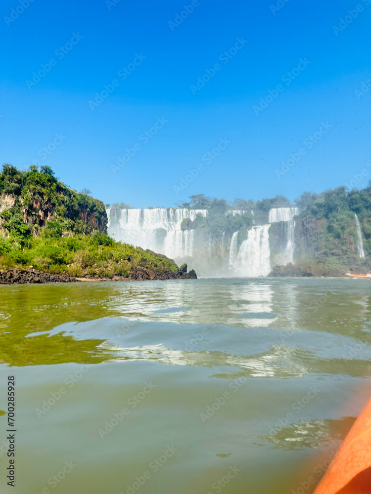 Obraz premium Iguazu Falls, Argentina. Iguazu Falls is the largest series of waterfalls in the world. Getting to know the beautiful waterfalls surrounded by nature on warm spring summer days