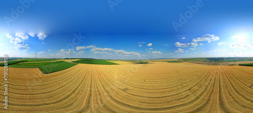 360 panorama of the agricultural field with summer landscape and wind turbines. Beautiful summer landscape