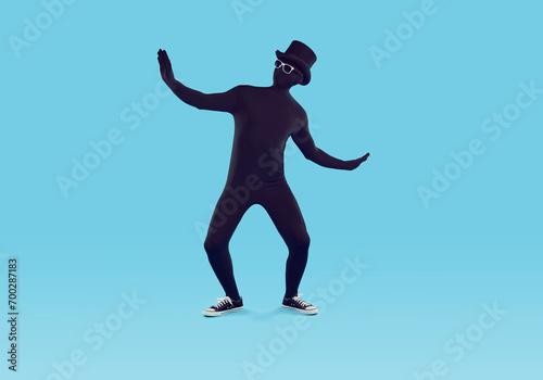 Tableau sur toile Full length portrait of a funny man disguised in a black skin tight spandex body