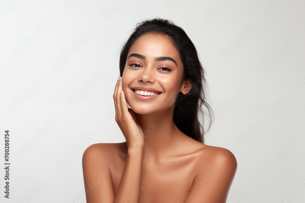 Beautiful happy young Indian woman touching her face caring for facial skin. Skincare concept Beautiful happy young Indian woman touching her face caring for facial skin. Skincare concept