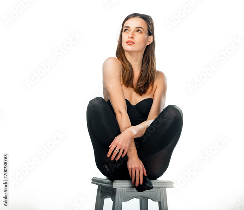 A Woman Sitting on a Stool