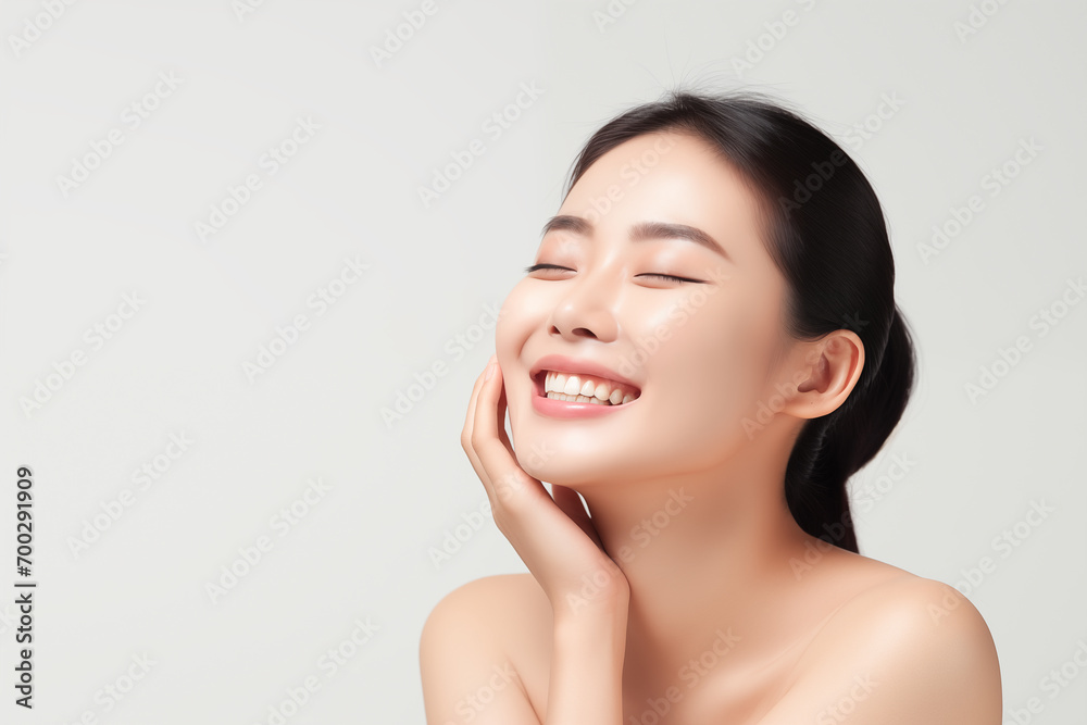 Beautiful happy young Asian woman touching her face caring for facial skin. Skincare concept Beautiful happy young Asian woman touching her face caring for facial skin. Skincare concept