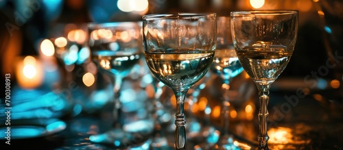 Plastic champagne glasses at bar table for various celebrations, served by catering for events. photo